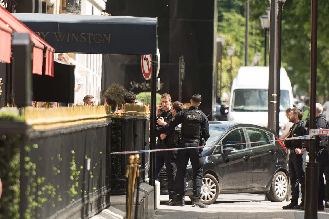Armed robbers snatched jewels from the  Harry Winston store on Paris' Avenue Montaigne, before escaping on motorcycles.