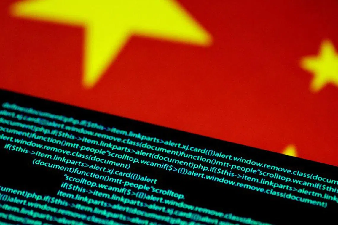 FILE PHOTO: Computer code is seen on a screen above a Chinese flag in this July 12, 2017 illustration photo.   REUTERS/Thomas White/Illustration/File Photo