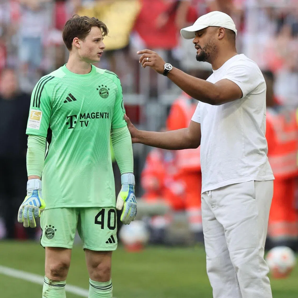 Bayern Munich coach Vincent Kompany giving instructions to his goalkeeper Jonas Urbig during their 3-3 Bundesliga draw with Heidenheim on May 2.