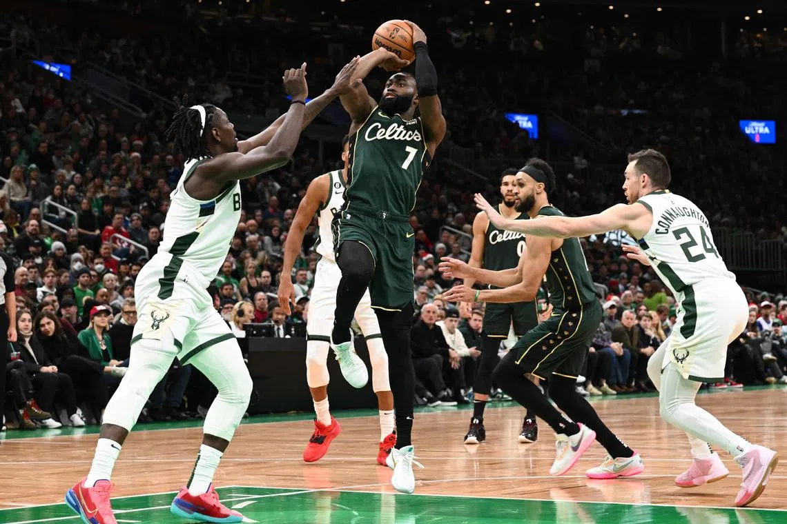 Jaylen Brown of the Boston Celtics attempting a basket against the Milwaukee Bucks during the first quarter at the TD Garden on Christmas Day.