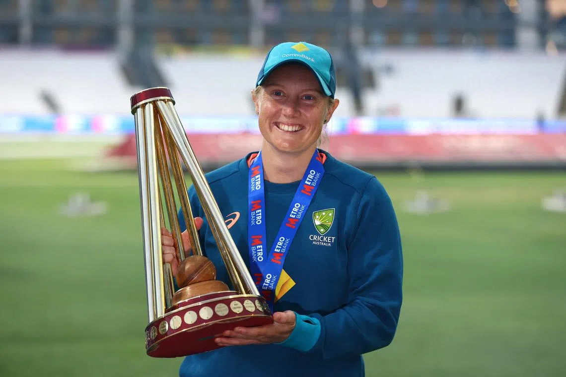 FILE PHOTO: Cricket - Women's One Day International Series - England v Australia - County Ground, Taunton, Britain - July 18, 2023 Australia's Alyssa Healy celebrates retaining the Ashes with the trophy Action Images via Reuters/Matthew Childs/File Photo
