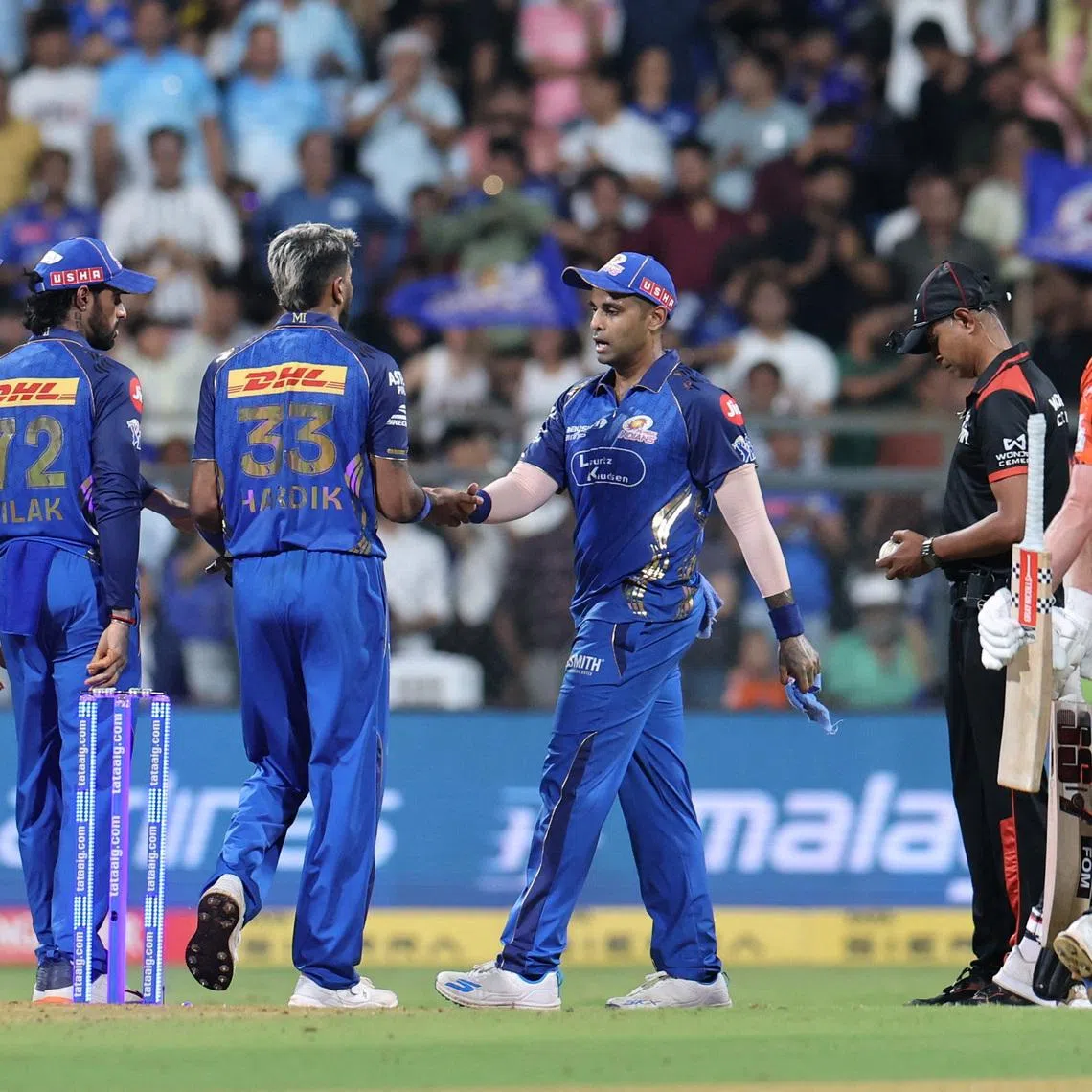 Cricket - Indian Premier League - IPL - Mumbai Indians v Sunrisers Hyderabad - Wankhede Stadium, Mumbai, India - April 29, 2026 Mumbai Indians' Hardik Pandya celebrates with teammate after taking the wicket of Sunrisers Hyderabad's Travis Head REUTERS/Francis Mascarenhas