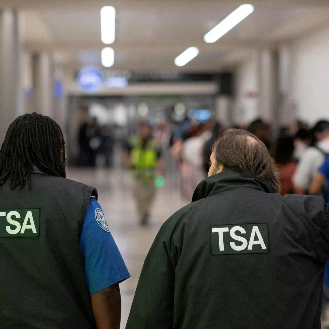 Transportation Security Administration (TSA) officers walk through the domestic terminal at Hartsfield-Jackson Atlanta International Airport in Atlanta, Georgia, U.S. March 27, 2026. REUTERS/Alyssa Pointer
