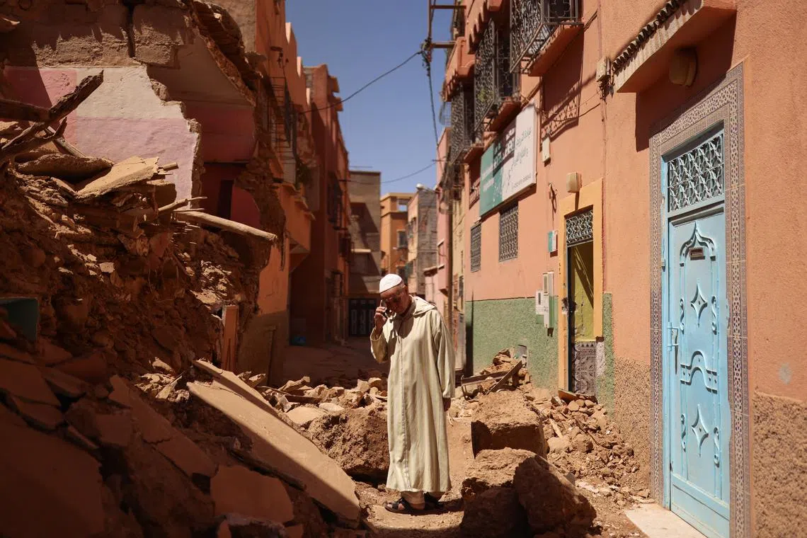 Mohamed Sebbagh, 66, stands in front of his destroyed house, in the aftermath of a deadly earthquake, in Amizmiz, Morocco, Sept 10, 2023. 