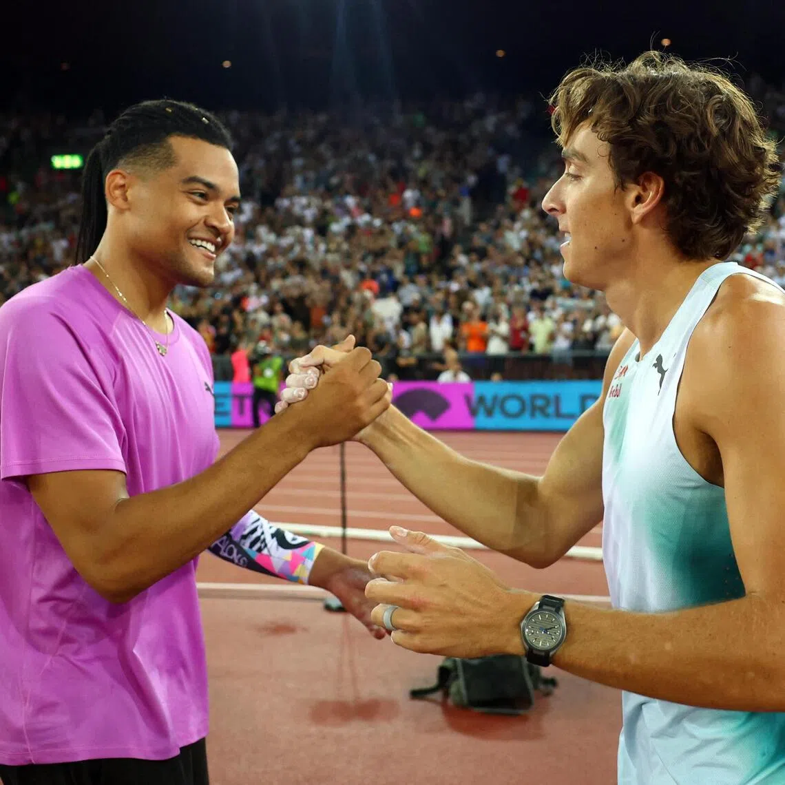 Sweden’s winner Armand Duplantis (right) and Greece’s runner-up Emmanouil Karalis congratulate each other after the Diamond League pole vault final on Aug 27.