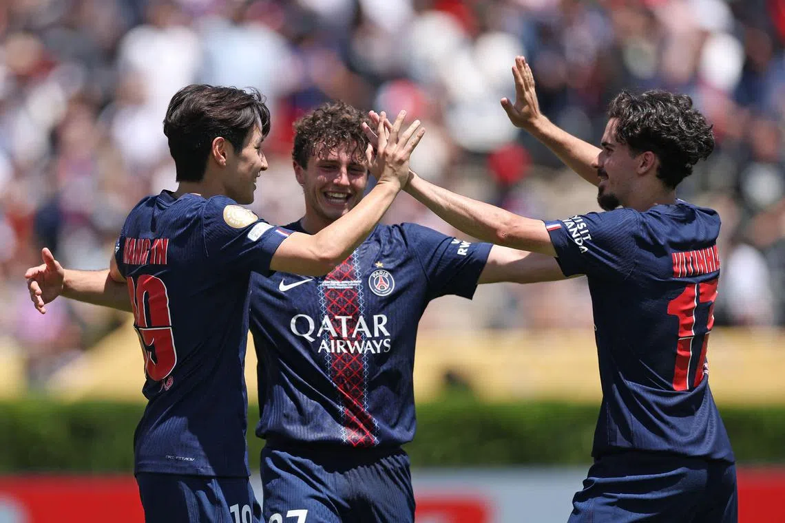 From far left: Lee Kang-in, Joao Neves and Vitinha celebrating following Paris Saint-Germain's 4-0 Club World Cup Group B win over Atletico Madrid at the Rose Bowl on June 15, 2025, in Pasadena, California. 