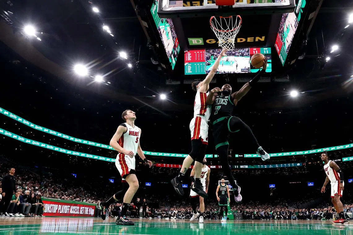 Jaylen Brown of the Boston Celtics takes a shot against Tyler Herro of the Miami Heat during Game 5 of the NBA Eastern Conference first-round play-offs.