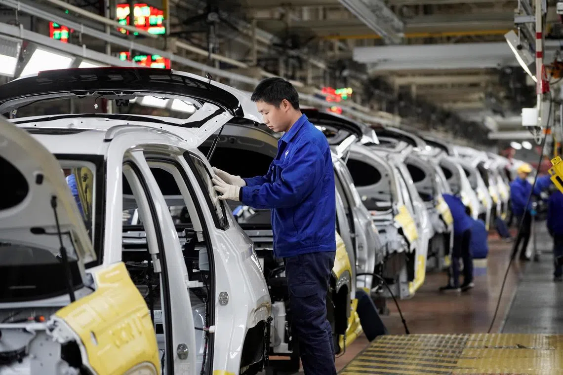 Workers at an assembly plant operated by General Motors and its local joint-venture partners in China. 
