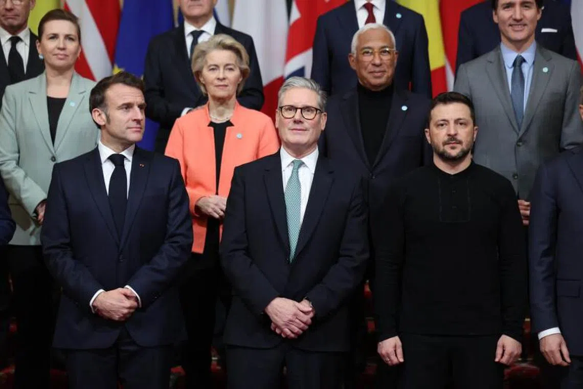 Emmanuel Macron, France's president, bottom left, Keir Starmer, UK's prime minister, bottom center, and Volodymyr Zelenskiy, Ukraine's president, bottom second right, and other world leaders at a family photo during a summit at Lancaster House in London, UK, on Sunday, March 2, 2025. Starmer is hosting Zelenskiy and more than a dozen other European leaders to discuss security guarantees the continent can offer Kyiv in the event of a ceasefire with Russia. Photographer: Neill Hall/EPA/Bloomberg
