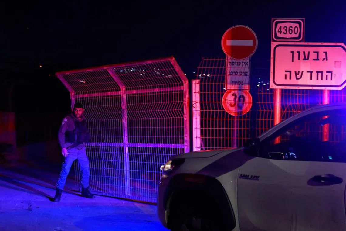 A member of Israeli security forces secures the area at which, according to Israeli emergency services, Israeli police killed a young Palestinian girl when they responded to a suspected ramming attack, near Givat Zeev, in the Israeli-occupied West Bank, January 7, 2024. REUTERS/Ammar Awad