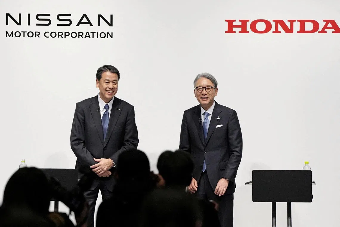 Nissan CEO Makoto Uchida and Honda CEO Toshihiro Mibe attend a joint press conference in Tokyo on March 15, 2024. 