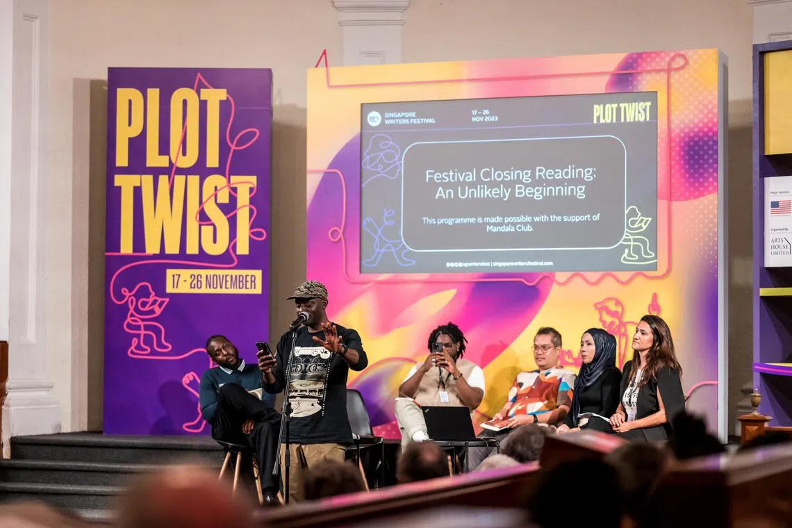 (From left) Poets Caleb Femi, Charlie Dark (standing), Yomi Sode, Lawrence Lacambra Ypil, Asnida Daud and Arianna Pozzuoli read at the closing reading of the 2023 Singapore Writers Festival. 