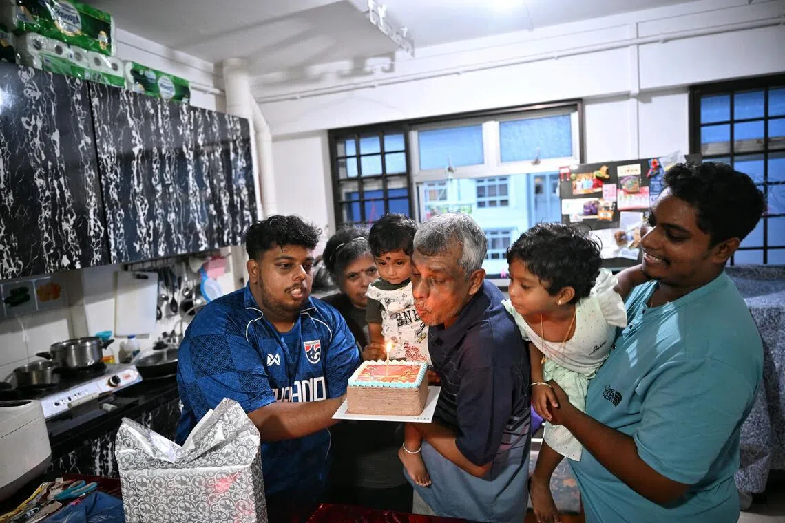 Karthigeyan (left) and and Shanger Pannerchelvam (right) are not only sons, but also protectors of their father, D. Pannerchelvam, who has intellectual disability. The family celebrated his 67th birthday in June.