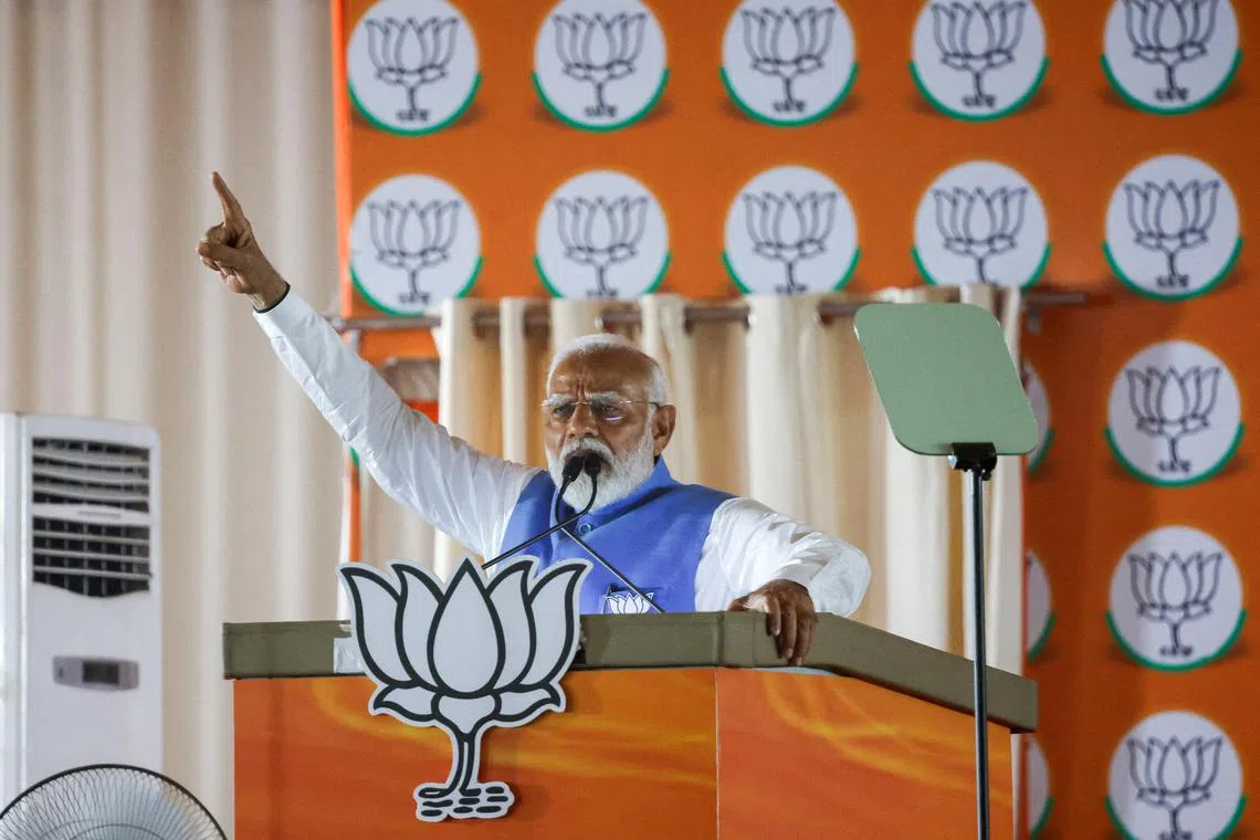 FILE PHOTO: India's Prime Minister Narendra Modi gestures as he addresses  supporters during an election campaign rally, in New Delhi, India, May 22, 2024. REUTERS/Adnan Abidi/File Photo