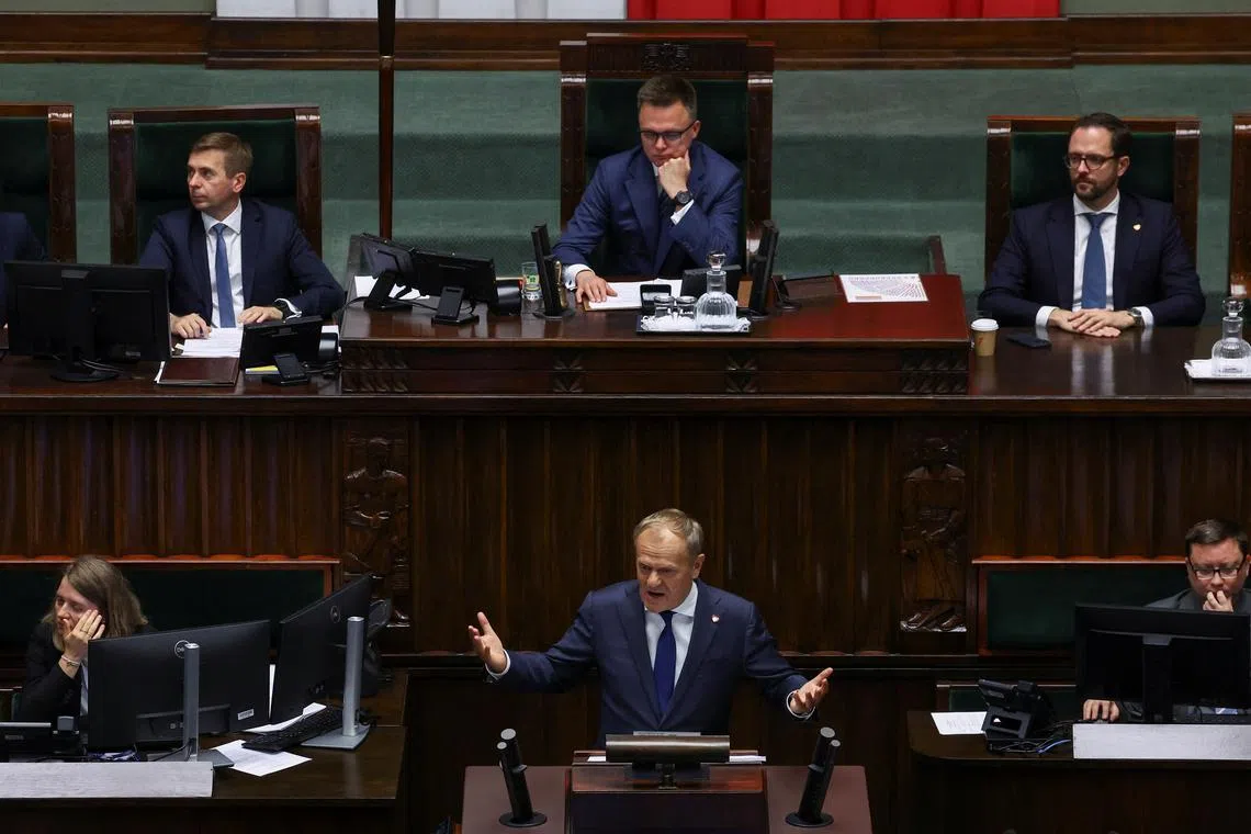 The Speaker of the Polish Parliament, Szymon Hołownia, observes as Prime Minister Donald Tusk responds to parliamentary inquiries on the day a vote of confidence is scheduled for his center-left coalition government, in Warsaw, Poland, June 11, 2025.  REUTERS/Kacper Pempel