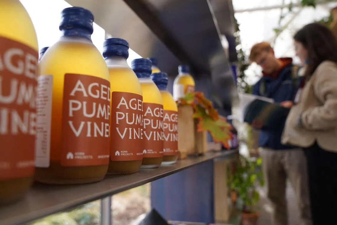 Bottles of Aged Pumpkin Vinegar stand on a shelf at noma’s new Projects Shop in Copenhagen, Denmark.