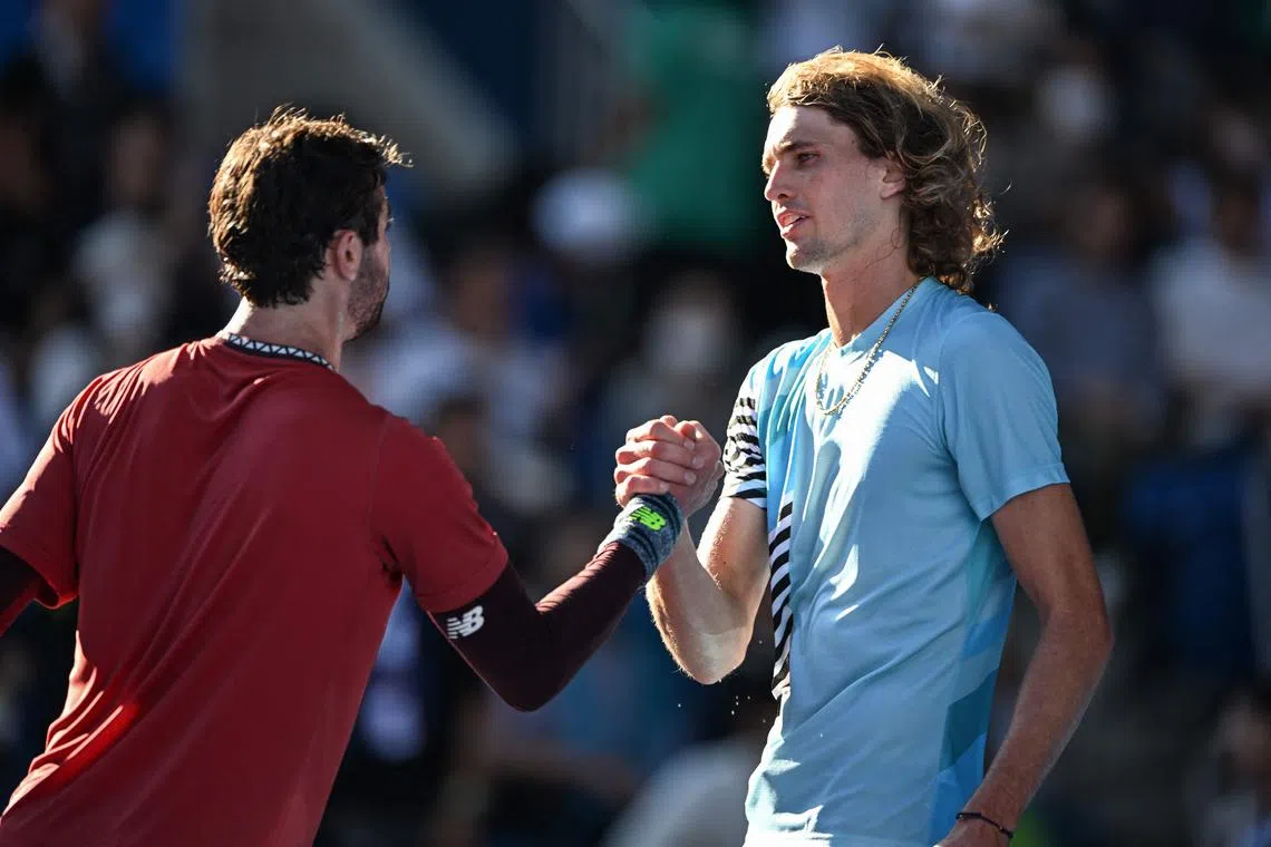 Australia's Jordan Thompson (left) shakes hands with Alexander Zverev of Germany after his victory in their men’s singles match.