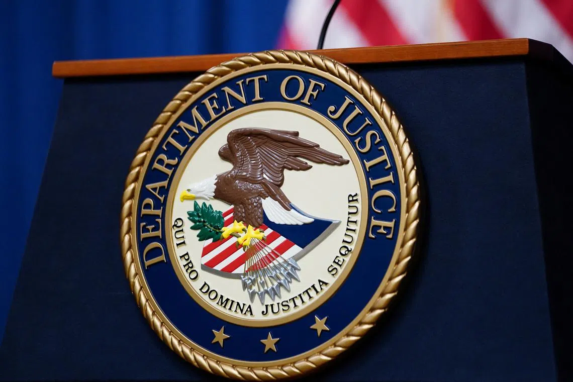 FILE PHOTO: The seal of the U.S. Justice Department is seen on the podium in the Department's headquarters briefing room before a news conference with the Attorney General in Washington, January 24, 2023.  REUTERS/Kevin Lamarque/File photo