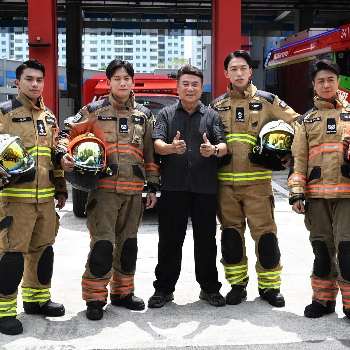 (From left) Actors Zhin Sadali, Noah Yap, Tosh Zhang and Maxi Lim, pictured with director Jack Neo (centre), have to mentor a new batch of recruits in Ah Boys To Firefighters.