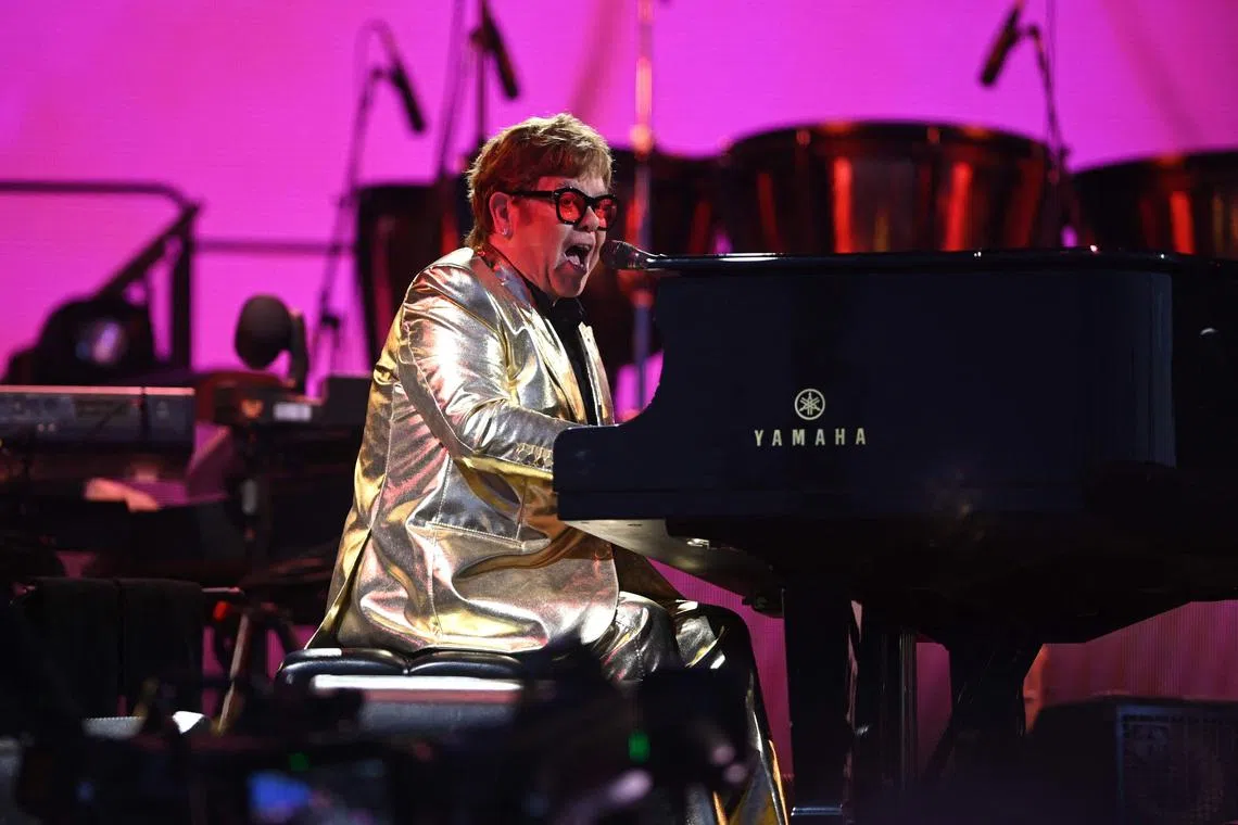 British legendary singer Elton John performs on the Pyramid Stage on day 5 of the Glastonbury festival in the village of Pilton in Somerset, southwest England, on June 25, 2023. 