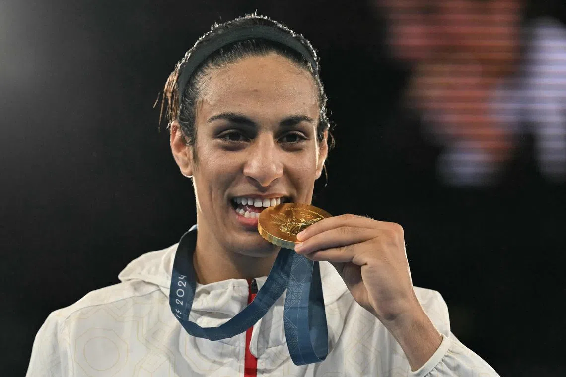 Imane Khelif on the podium after winning gold medal for the women's 66kg final boxing category at the Paris Olympics. 