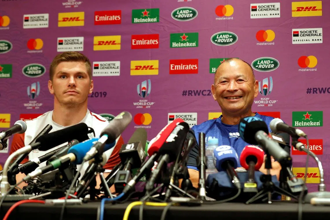 Former England coach Eddie Jones (right) and England captain Owen Farrell during a press conference in 2019. 