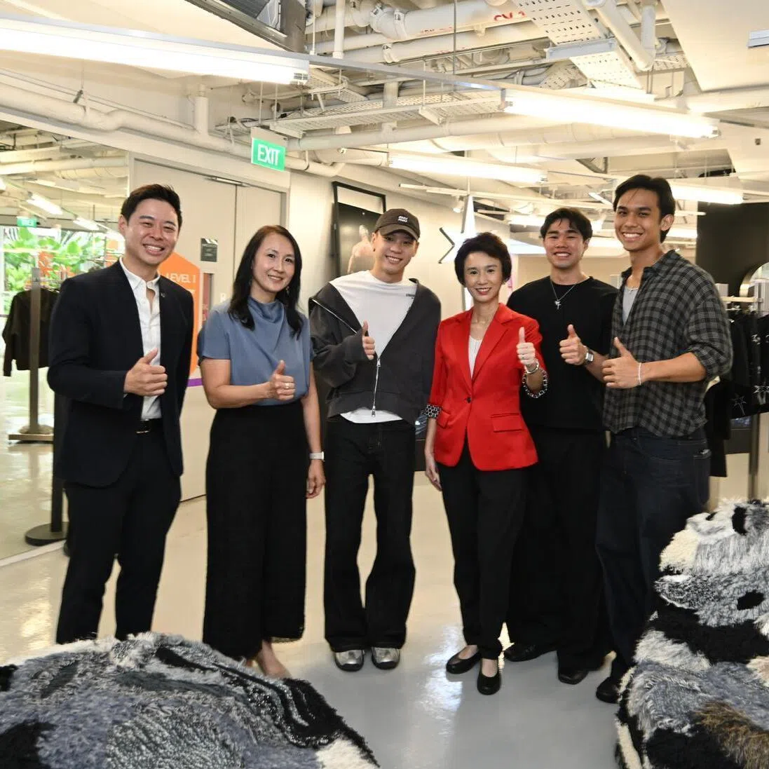 Senior Minister of State for Trade and Industry Low Yen Ling (centre in red) at the Retail Reimagined – From Now to Next event held at *SCAPE on May 26, 2026.  She is accompanied by (left to right) Mr John Cheng, chief executive of Innovate360, Ms Jeannie Lim, assistant managing director of EnterpriseSG
Mr Calvin Go, Mr Gabriel Loo and Mr Declan Sin, co-founders of Koyoyu Studio.
