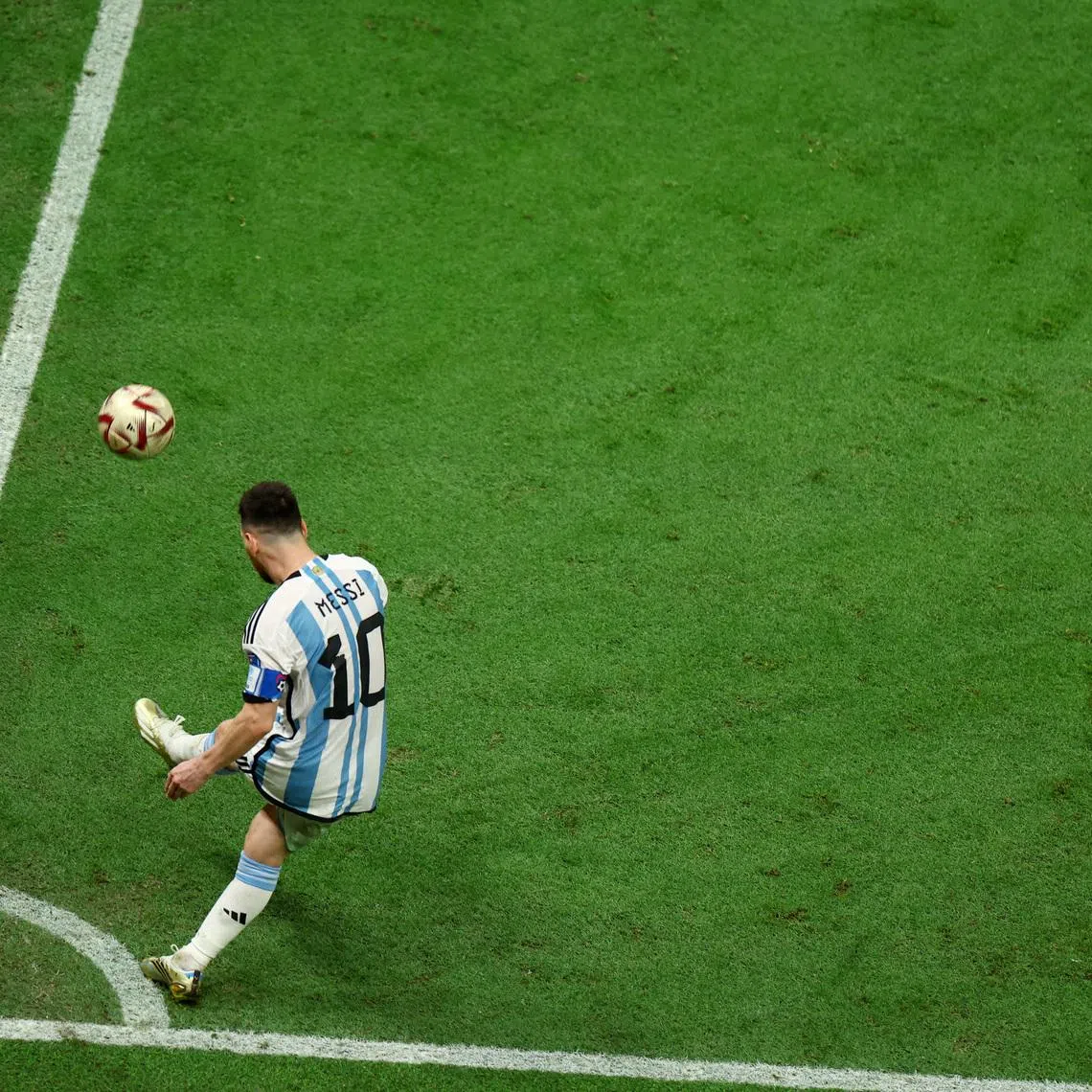 FILE PHOTO: Soccer Football - FIFA World Cup Qatar 2022 - Final - Argentina v France - Lusail Stadium, Lusail, Qatar - December 18, 2022 Argentina's Lionel Messi takes a corner kick REUTERS/Molly Darlington/File Photo
