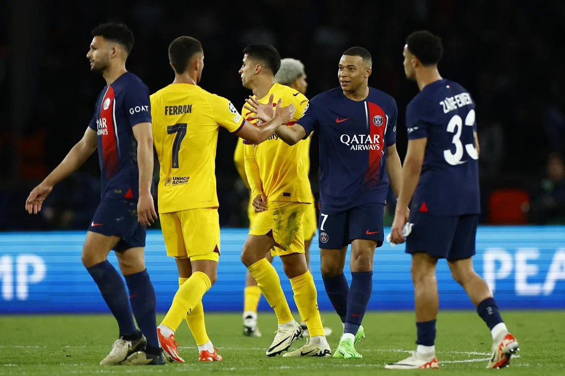 Soccer Football - Champions League - Quarter Final - First Leg - Paris St Germain v FC Barcelona - Parc des Princes, Paris, France - April 10, 2024 FC Barcelona's Ferran Torres shakes hands with Paris St Germain's Kylian Mbappe after the match REUTERS/Sarah Meyssonnier