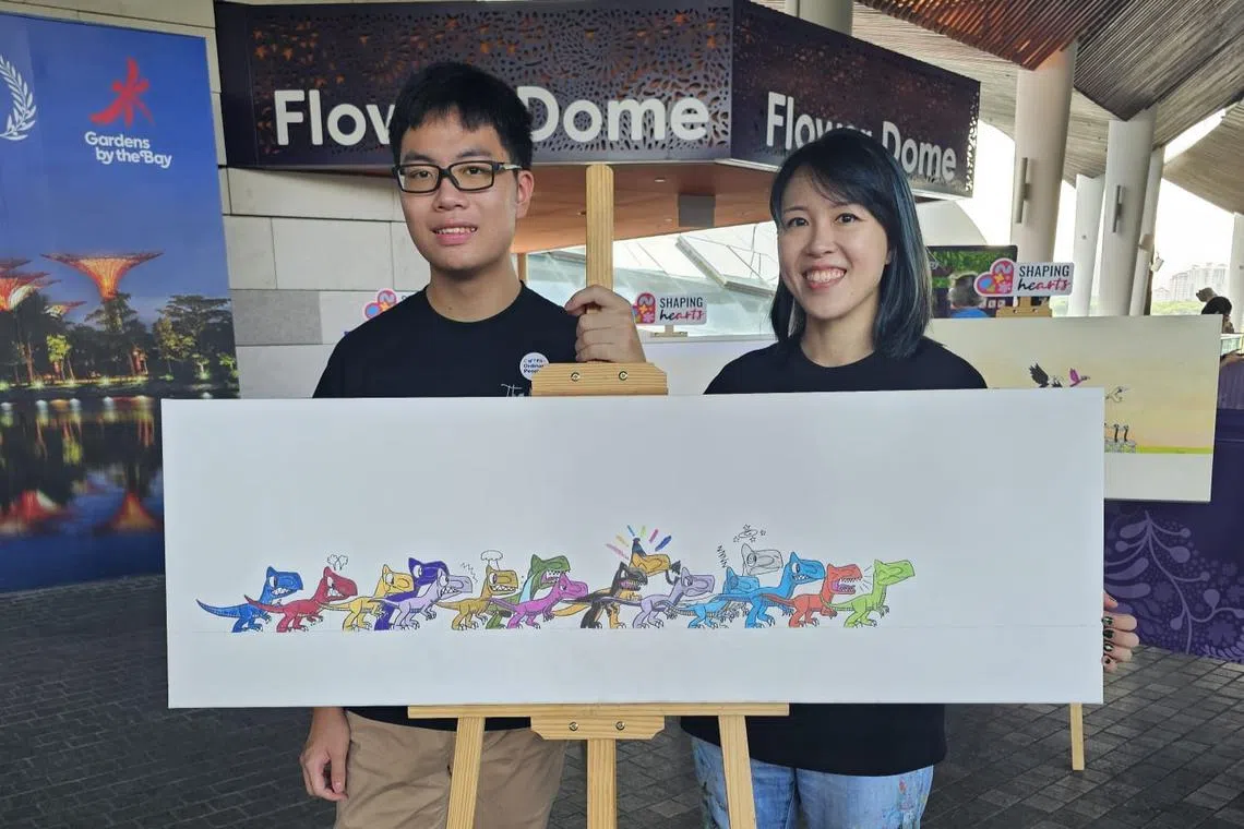 lun wei shi (right) special needs educator at extraordinary people and master of special and inclusive education programme student at newcastle australia institute of higher education singapore, and her student thaddeus chew pictured here with his painting completed live at a community event