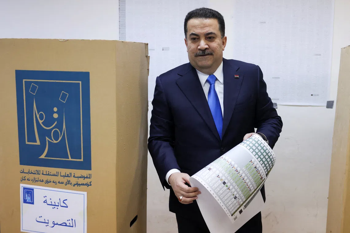 Iraqi Prime Minister Mohammed Shia al-Sudani votes at a polling station in the Green Zone during the parliamentary election, in Baghdad, Iraq, November 11, 2025. REUTERS/Ahmed Saad
