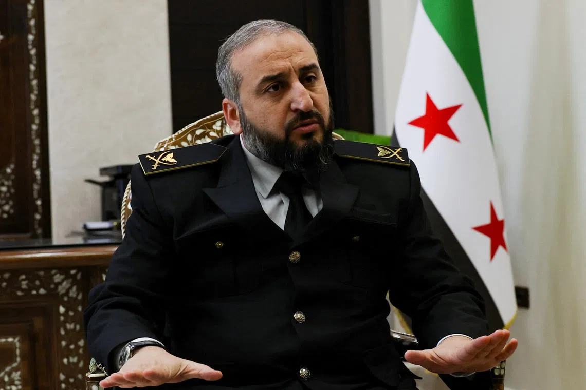 Syria's new defense minister Murhaf Abu Qasra attends an interview with Reuters in Damascus, Syria January 19, 2025. REUTERS/Yamam Al Shaar