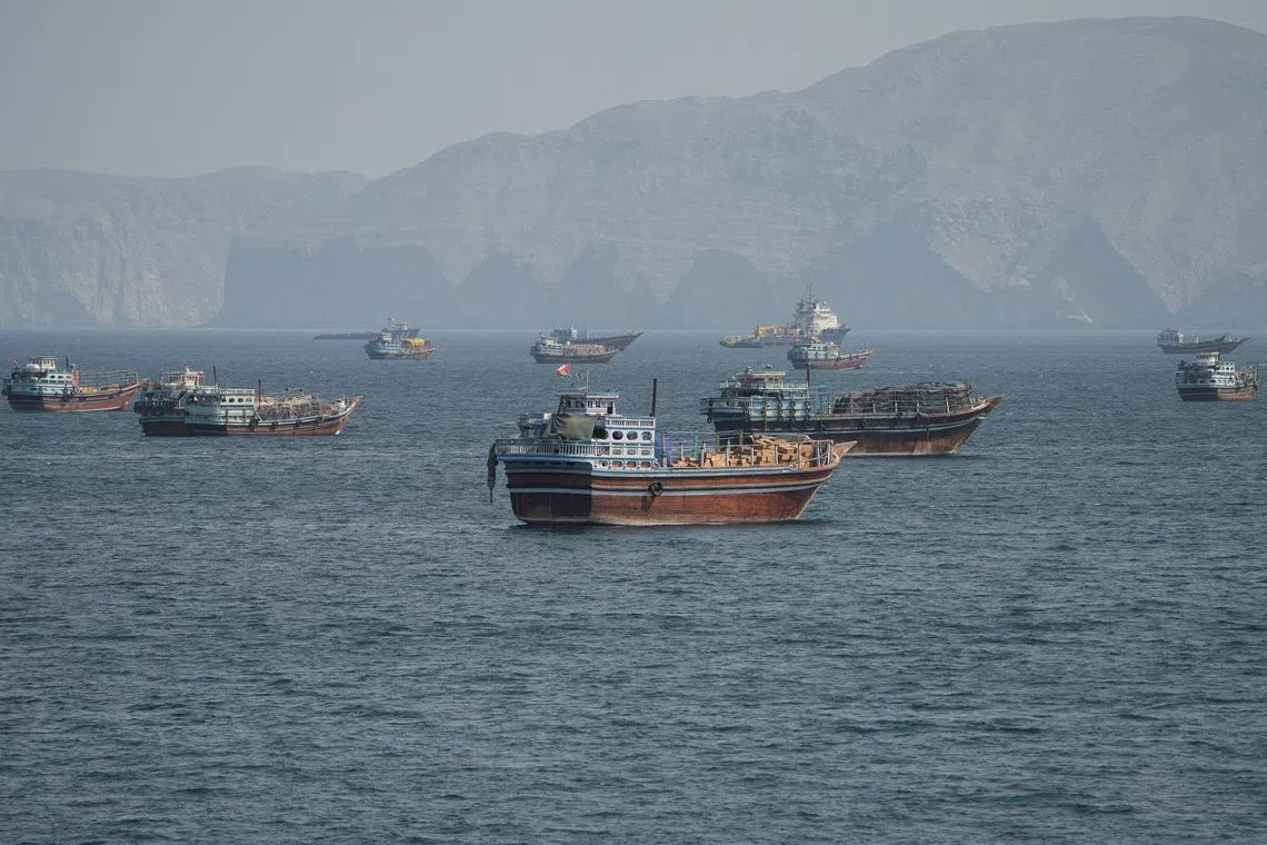 FILE PHOTO: Vessels at the Strait of Hormuz, as seen from Musandam, Oman, October 2, 2026. REUTERS/Stringer/File Photo