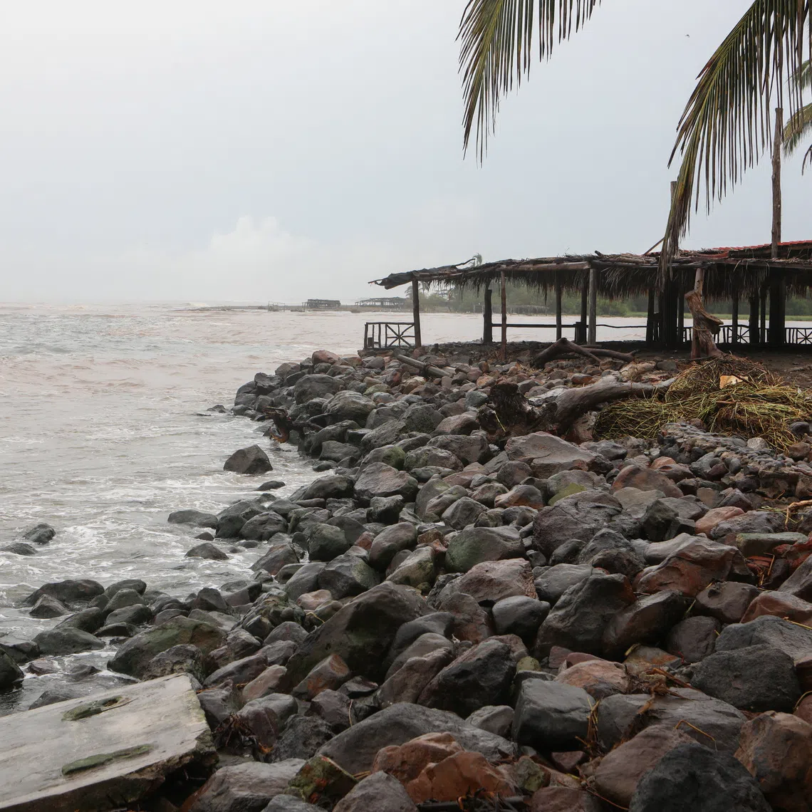 Clouds loom over a beach as Hurricane Trudy advances across the Pacific Ocean off Mexico's western coast, in Boca de Apiza, Michoacan state, Mexico, October 17, 2026. REUTERS/Gustavo Vilchis