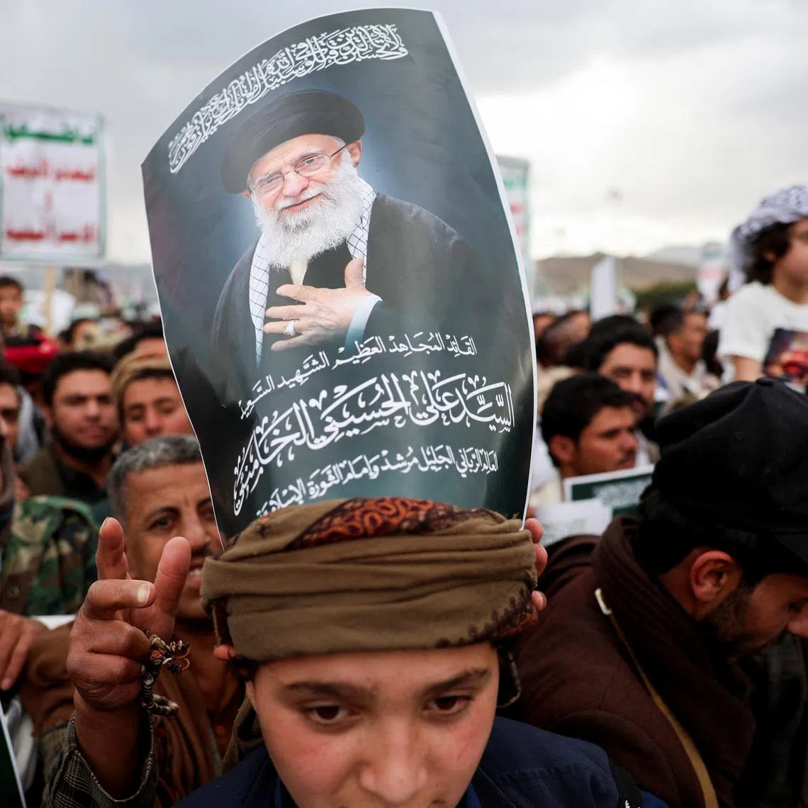 A protester with a poster on his head featuring a picture of late Iran's Supreme Leader Ayatollah Ali Khamenei joins a demonstration with Houthi supporters in solidarity with Iran and Lebanon, amid the U.S.-Israeli conflict with Iran, in Sanaa, Yemen March 6, 2026. REUTERS/Khaled Abdullah