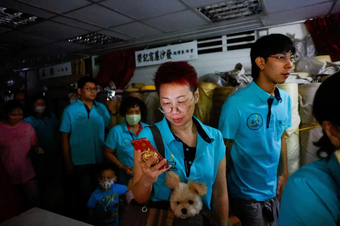 People participate in the annual air-raid exercise, where people are ordered to stay indoors for 30 minutes in Taipei, Taiwan July 23, 2024. REUTERS/Ann Wang 
