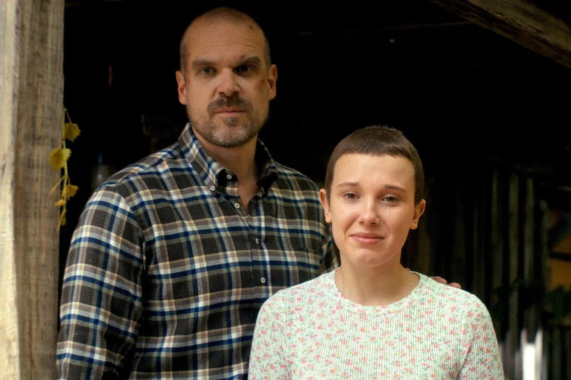 Millie Bobby Brown (right) and David Harbour play daughter and father in Stranger Things.