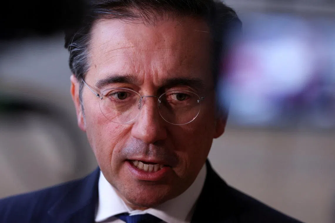 FILE PHOTO: Spanish Foreign Minister Jose Manuel Albares speaks to members of the media as he arrives to attend a European Union Energy and Foreign Affairs ministers meeting in Brussels, Belgium March 16, 2026. REUTERS/Omar Havana/File Photo