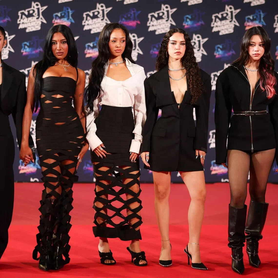 (From left) Katseye embers Sophia, Guest, Manon, Daniela, Megan and Yoonchae on the red carpet of the NRJ Music Awards ceremony in Cannes on Oct 31.