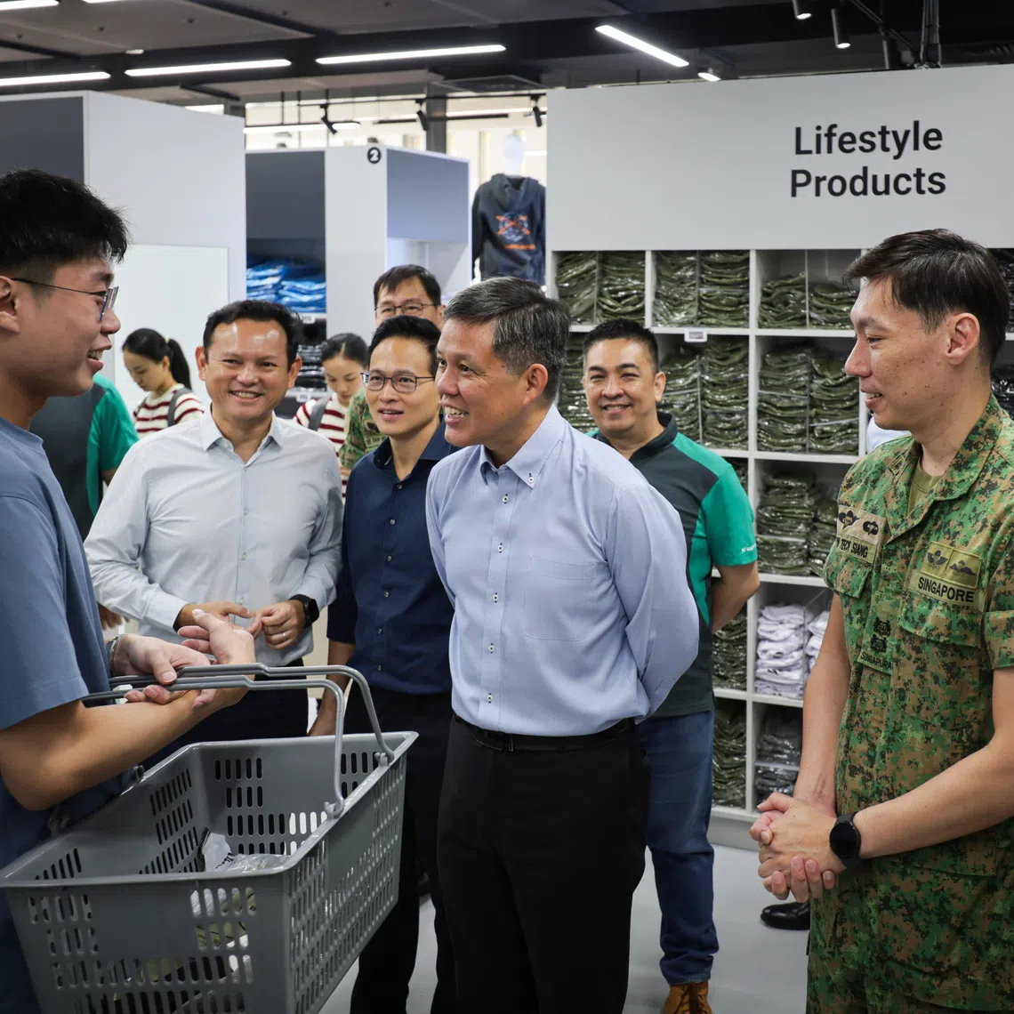 Defence Minister Chan Chun Sing (centre) speaking to an NSman during his tour of the Lifestylemart at the new Central Manpower Base in Bukit Gombak on Oct 14.