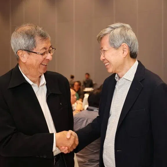 Mr Tan Hee Teck (right) will take over the reins from former Cabinet minister Lim Boon Heng (left). PHOTO: NTUC ENTERPRISE
