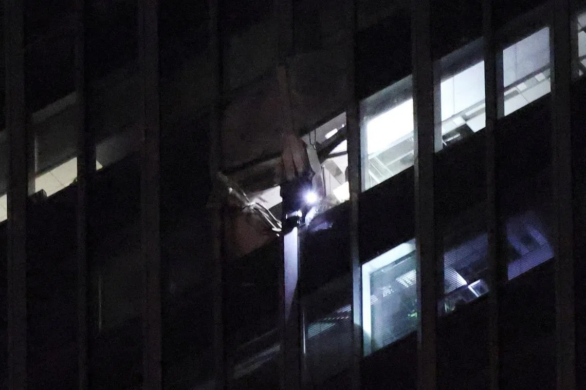 The damaged exterior of CITIC Tower. Observers say the crash is highly unusual, given that Beijing’s airspace is among the world’s most restricted.