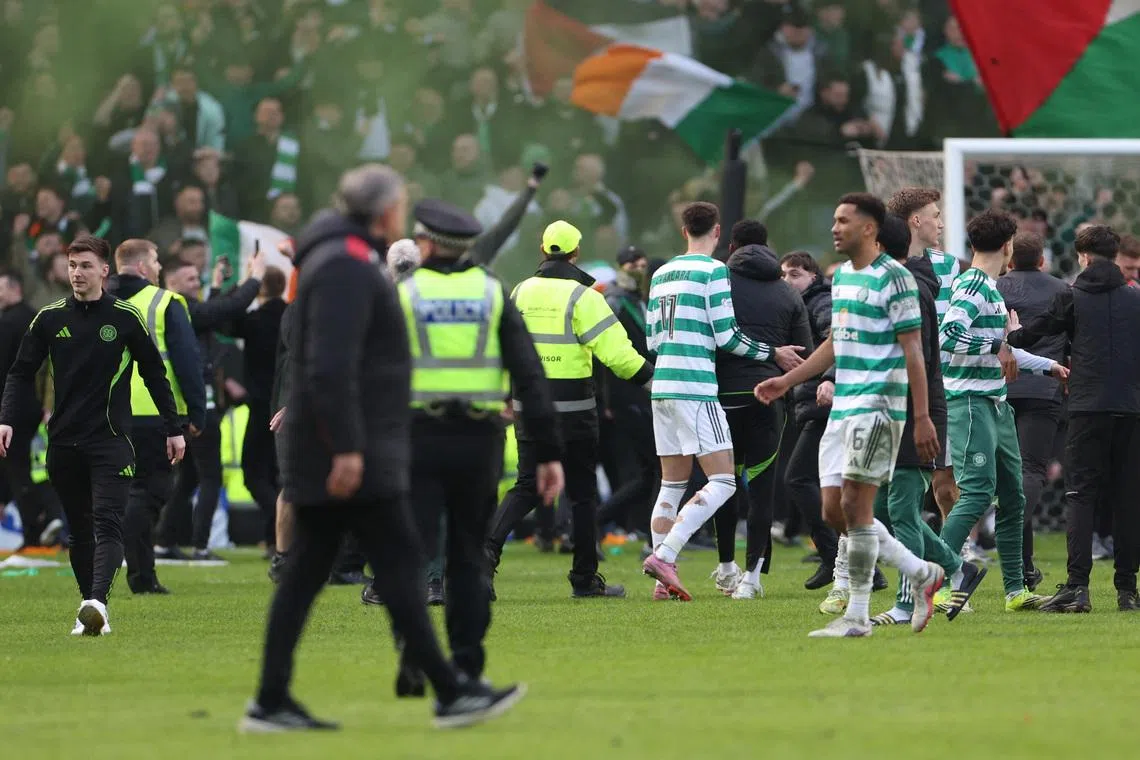Soccer Football - Scottish League Cup - Quarter Final - Rangers v Celtic - Ibrox, Glasgow, Scotland, Britain - March 8, 2026 Celtic's Auston Trusty celebrates after the match REUTERS/Russell Cheyne
