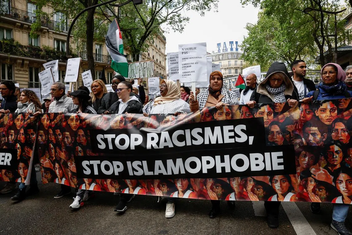 FILE PHOTO: People attend a demonstration called by various organisations against racism, Islamophobia and the protection of children in Paris, France, April 21, 2024. REUTERS/Benoit Tessier/File Photo