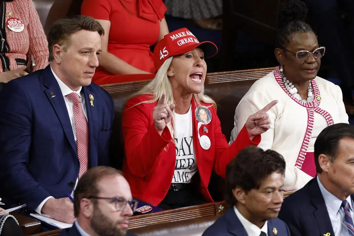 Representative Marjorie Taylor Greene wears a pin referencing a student murdered by an undocumented immigrant. 