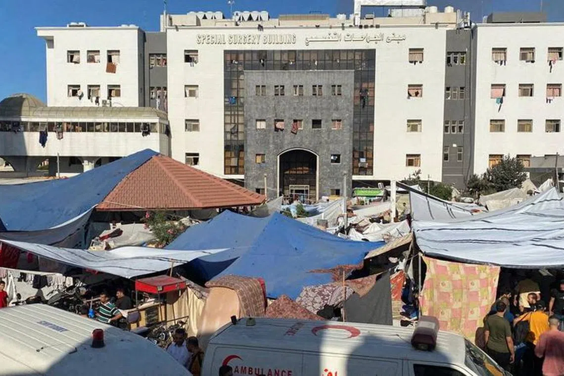 People, including Palestinian children, who fled their house due to Israeli strikes, gather at Al Shifa hospital where they shelter, amid the ongoing conflict between Israel and Palestinian Islamist group Hamas, in Gaza City November 7, 2023. REUTERS/Stringer