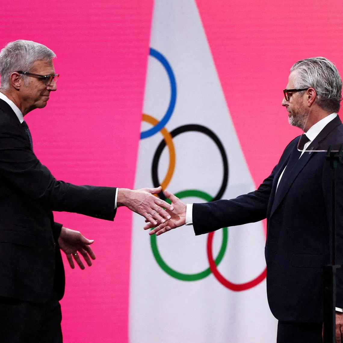 FILE PHOTO: Milano Cortina 2026 Winter Olympics - 145th IOC Session - Auditorium MPC, Milan, Italy - February 3, 2026 Chairman of the Los Angeles Organizing Committee for the 2028 Olympic and Paralympic Games, Casey Wasserman with Reynold Hoover, chief executive officer of the 2028 Summer Olympics during the 145th IOC Session REUTERS/Guglielmo Mangiapane/File Photo