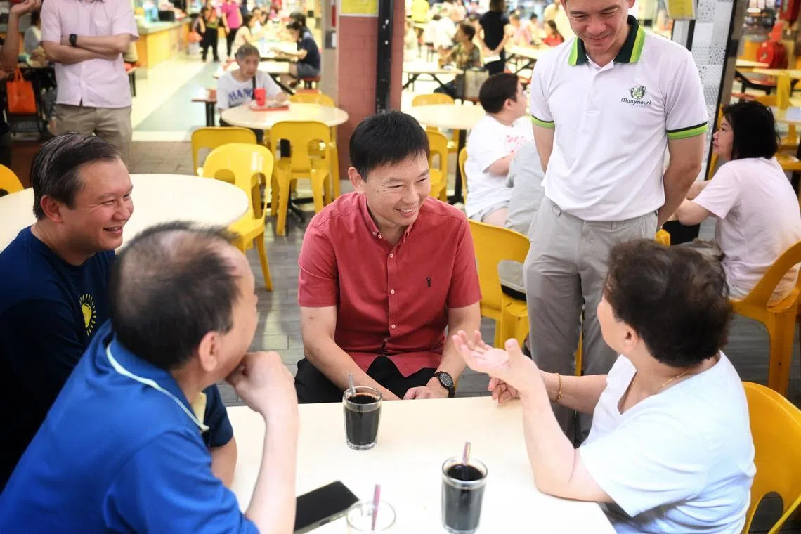 Transport Minister and MP for Bishan-Toa Payoh GRC Chee Hong Tat (centre) mingling with residents at a coffee shop at Bishan Street 24 on March 16.