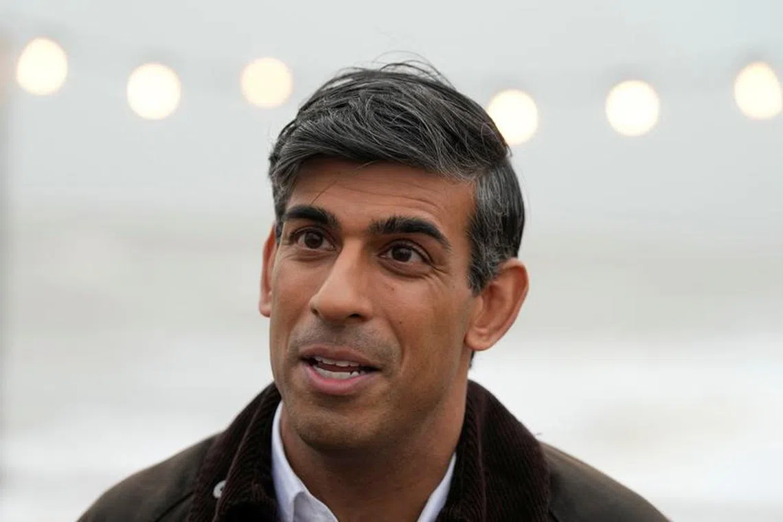British Prime Minister Rishi Sunak speaks to a TV reporter during his visit to Clacton-on-Sea, Britain, Wednesday, Oct. 18, 2023. Frank Augstein/Pool via REUTERS