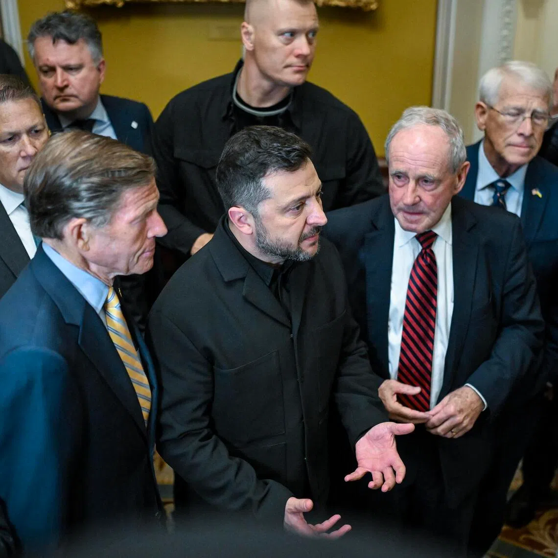 Ukrainian President Volodymyr Zelensky (centre) speaking to reporters after a meeting with US senators in Washington on July 28.